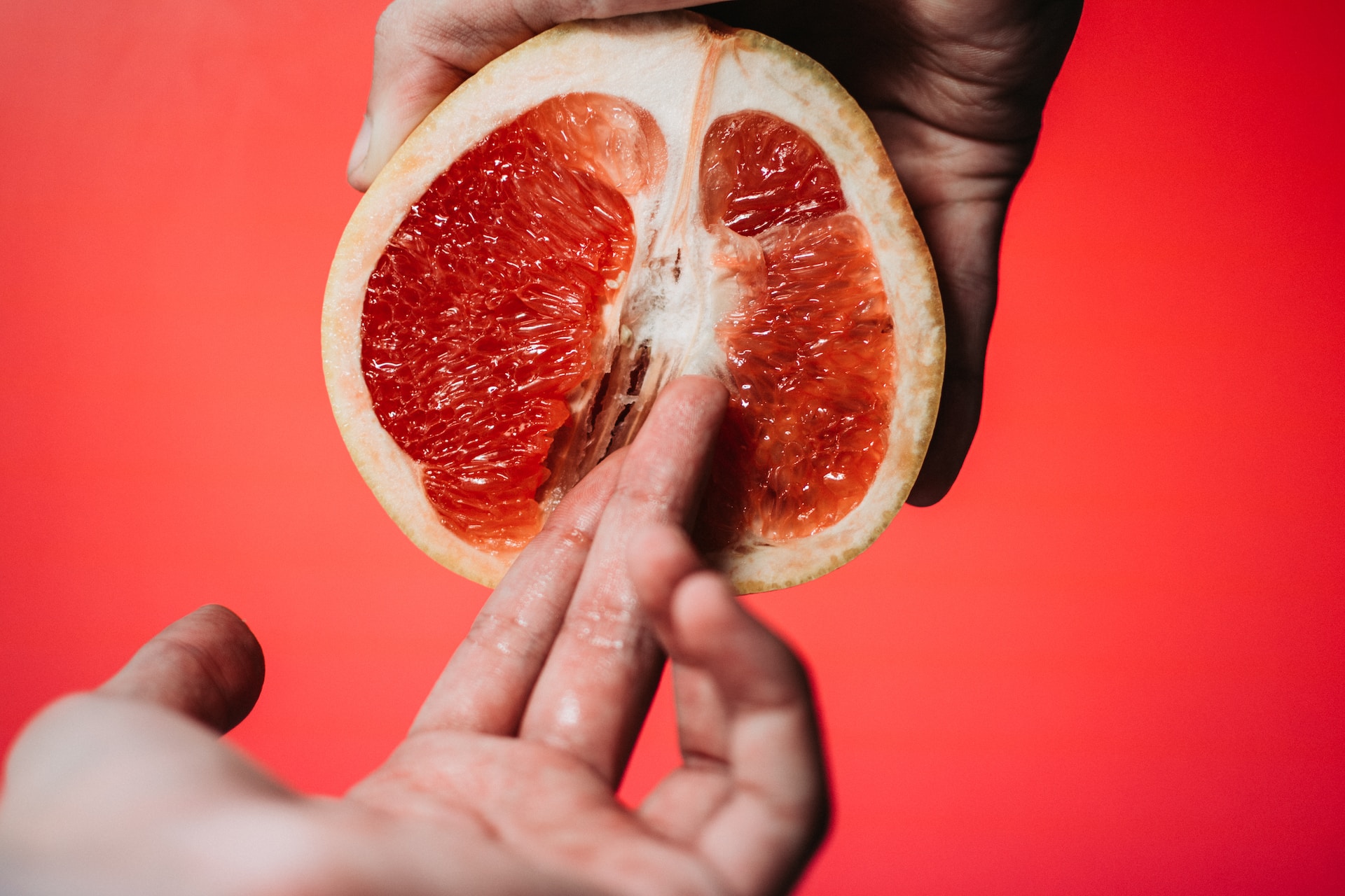 The picture shows a finger entering a grapefruit which should symbolize the idea of someone having sex during their period.